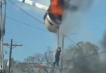 Esto sucedió en Baton Rouge, Luisiana… Un trabajador de servicios públicos lucha por bajar de un camión con canasta que está en llamas